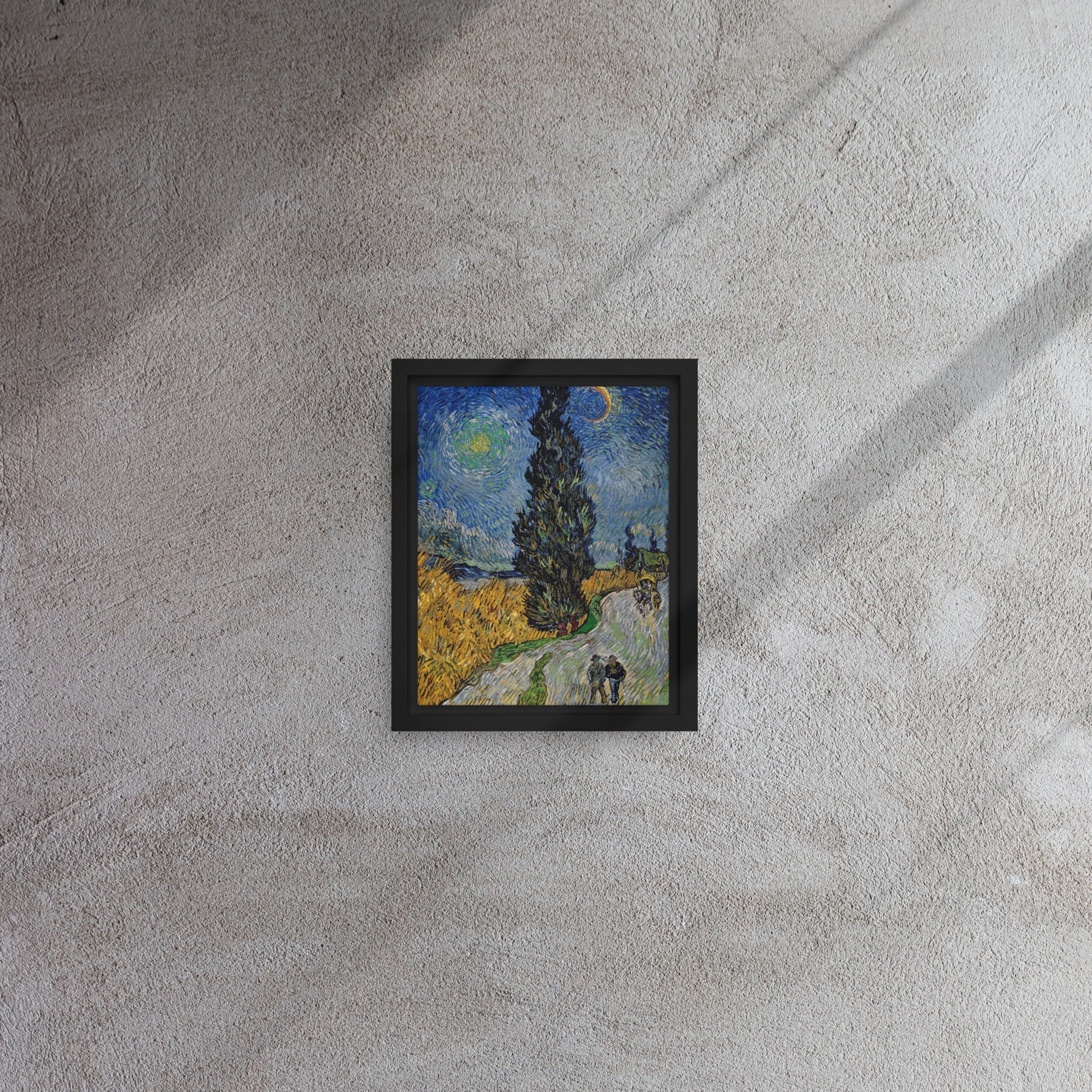 Van Gogh's 'Road with Cypress and Star' on a 8"x10" black framed canvas print on a textured gray wall.