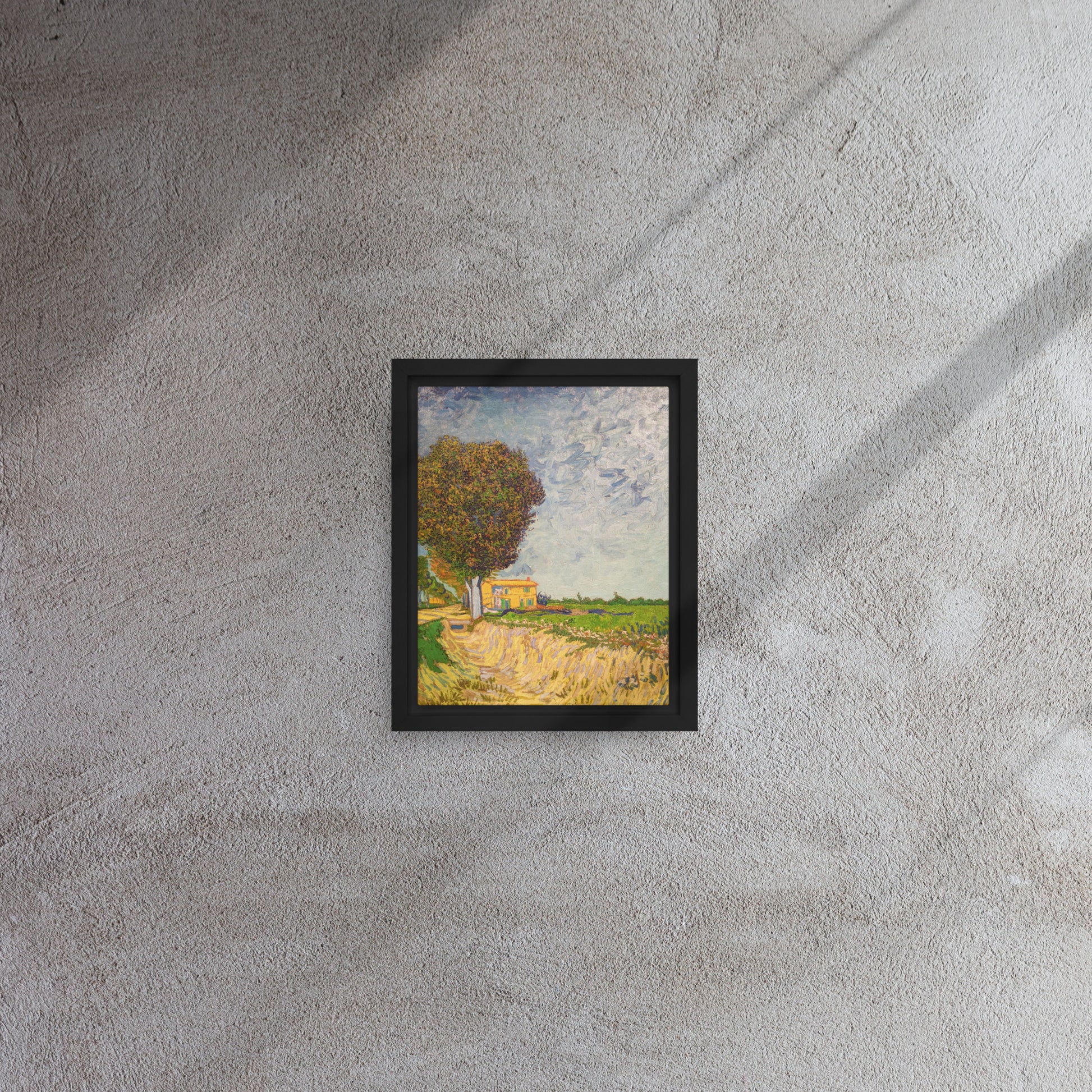 Van Gogh's 'A Lane near Arles' on a 8"x10" black framed canvas print on a textured gray wall.