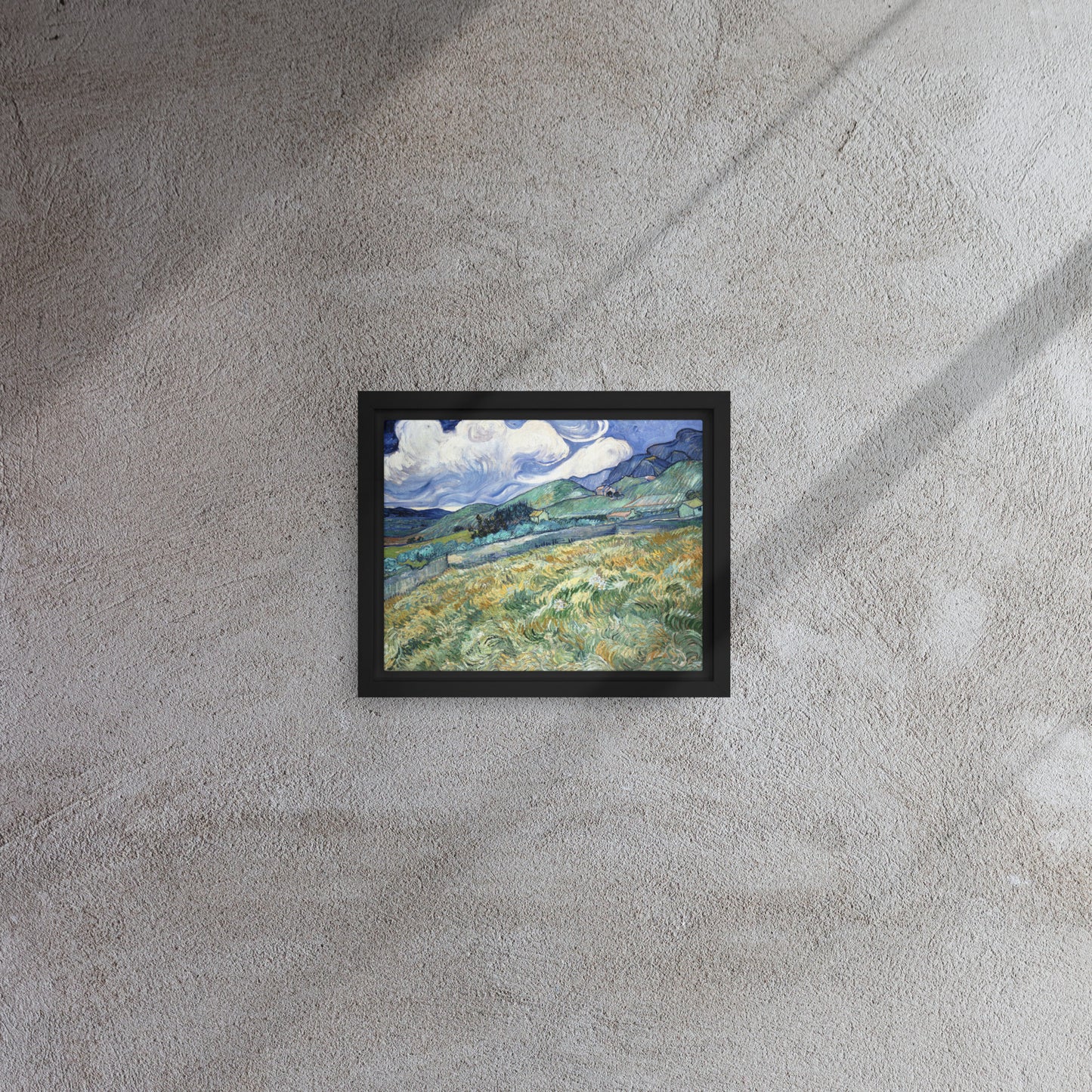 Van Gogh's 'Landscape from Saint-Rémy' on a 8"x10" black framed canvas print on a textured gray wall.