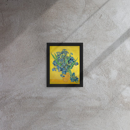 Van Gogh's 'Vase with Irises Against a Yellow Background' on a 8"x10" black framed canvas print on a textured gray wall.