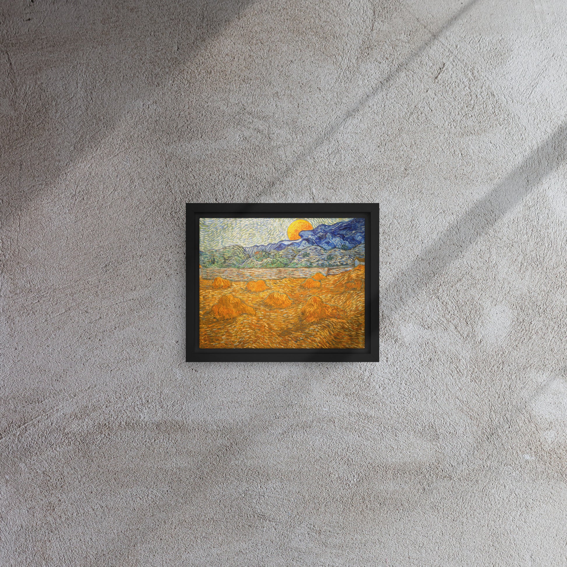 Van Gogh's 'Landscape with Wheat Sheaves and Rising Moon' on a 8"x10" black framed canvas print on a textured gray wall.