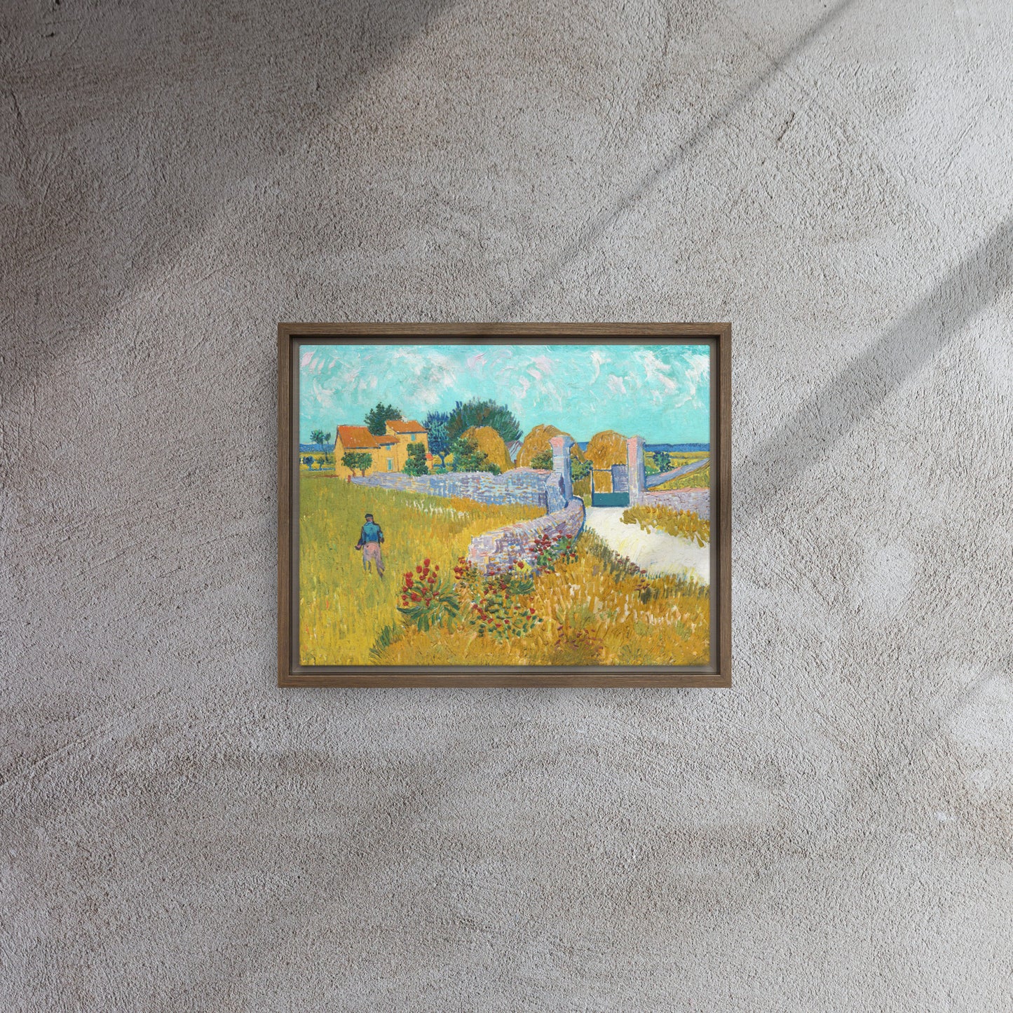 Van Gogh's 'Farmhouse in Provence' on a 11"x14" brown framed canvas print on a textured gray wall.
