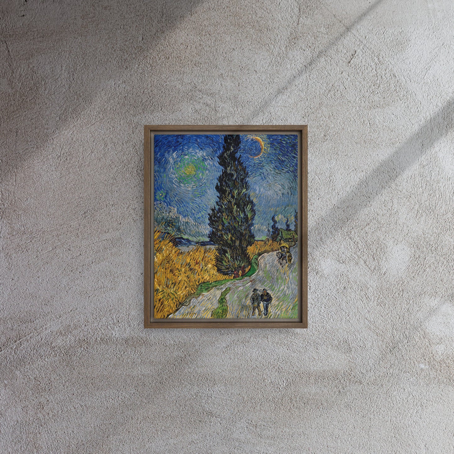Van Gogh's 'Road with Cypress and Star' on a 11"x14" brown framed canvas print on a textured gray wall.