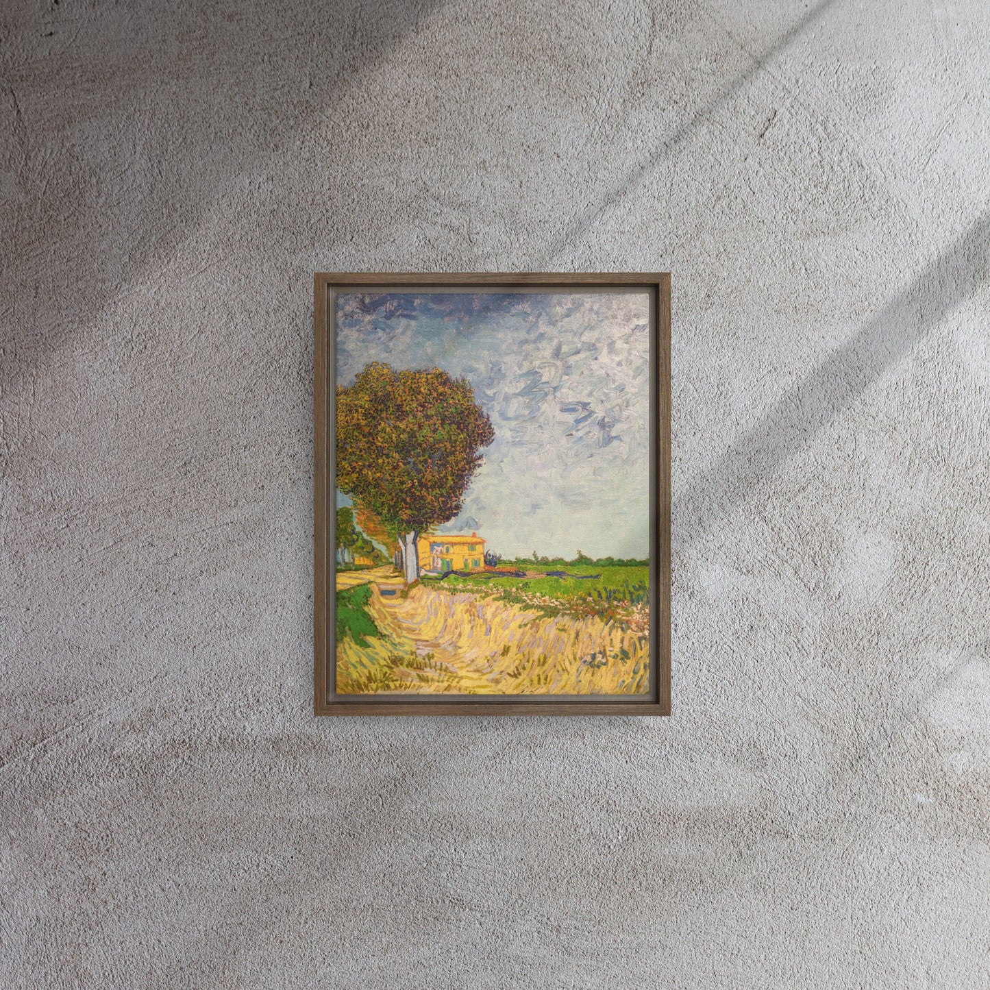 Van Gogh's 'A Lane near Arles' on a 11"x14" brown framed canvas print on a textured gray wall.