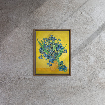 Van Gogh's 'Vase with Irises Against a Yellow Background' on a 11"x14" brown framed canvas print on a textured gray wall.