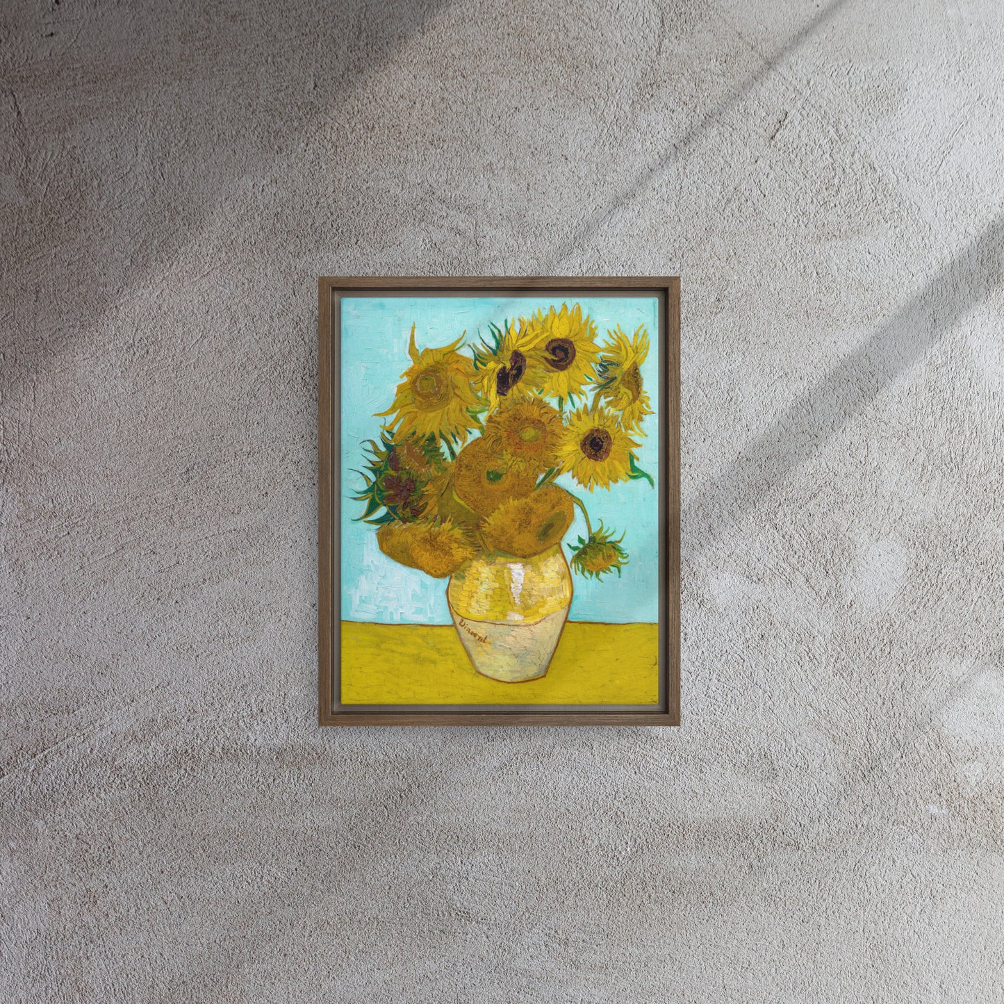 Van Gogh's 'Vase with Twelve Sunflowers' on a 11"x14" brown framed canvas print on a textured gray wall.