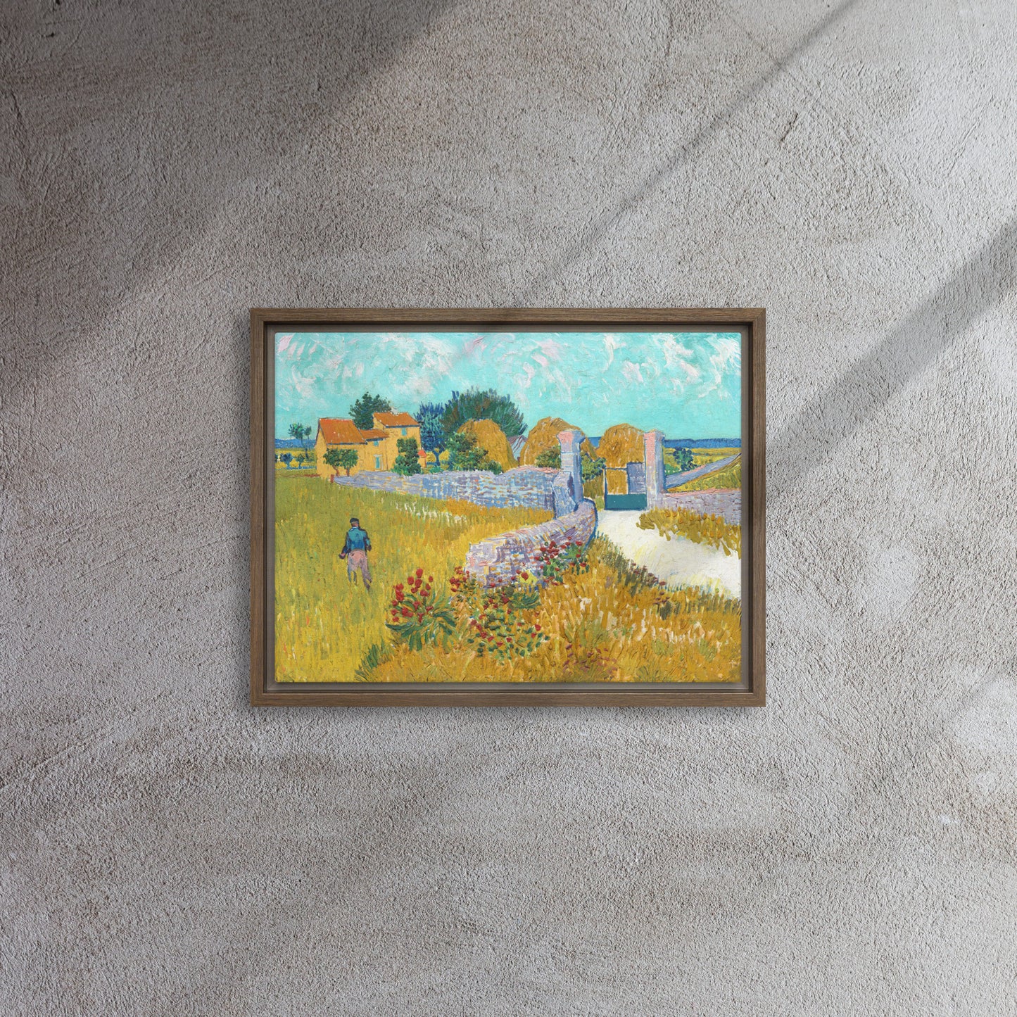 Van Gogh's 'Farmhouse in Provence' on a 12"x16" brown framed canvas print on a textured gray wall.