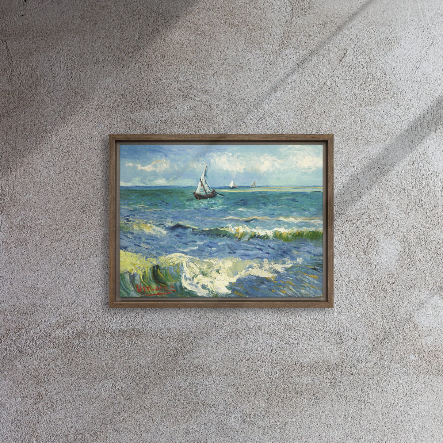 Van Gogh's 'The Sea at Les Saintes-Maries-de-la-Mer' on a 12"x16" brown framed canvas print on a textured gray wall.
