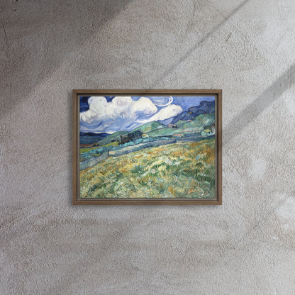 Van Gogh's 'Landscape from Saint-Rémy' on a 12"x16" brown framed canvas print on a textured gray wall.