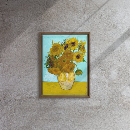 Van Gogh's 'Vase with Twelve Sunflowers' on a 12"x16" brown framed canvas print on a textured gray wall.