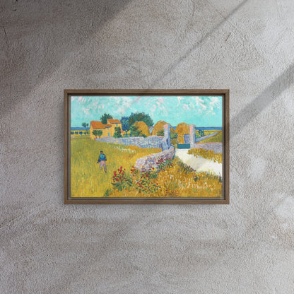 Van Gogh's 'Farmhouse in Provence' on a 12"x18" brown framed canvas print on a textured gray wall.