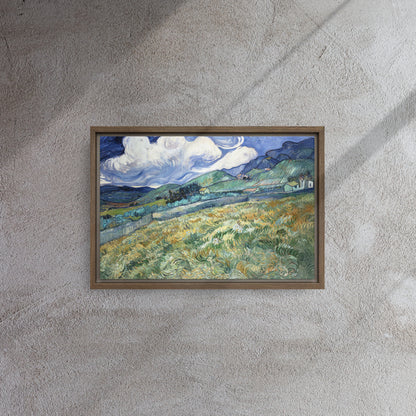Van Gogh's 'Landscape from Saint-Rémy' on a 12"x18" brown framed canvas print on a textured gray wall.
