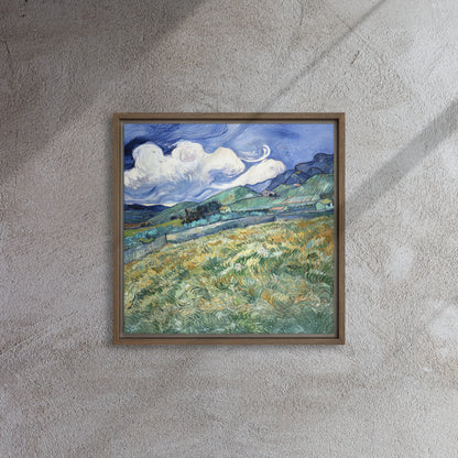 Van Gogh's 'Landscape from Saint-Rémy' on a 16"x16" brown framed canvas print on a textured gray wall.