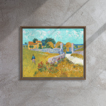 Van Gogh's 'Farmhouse in Provence' on a 16"x20" brown framed canvas print on a textured gray wall.
