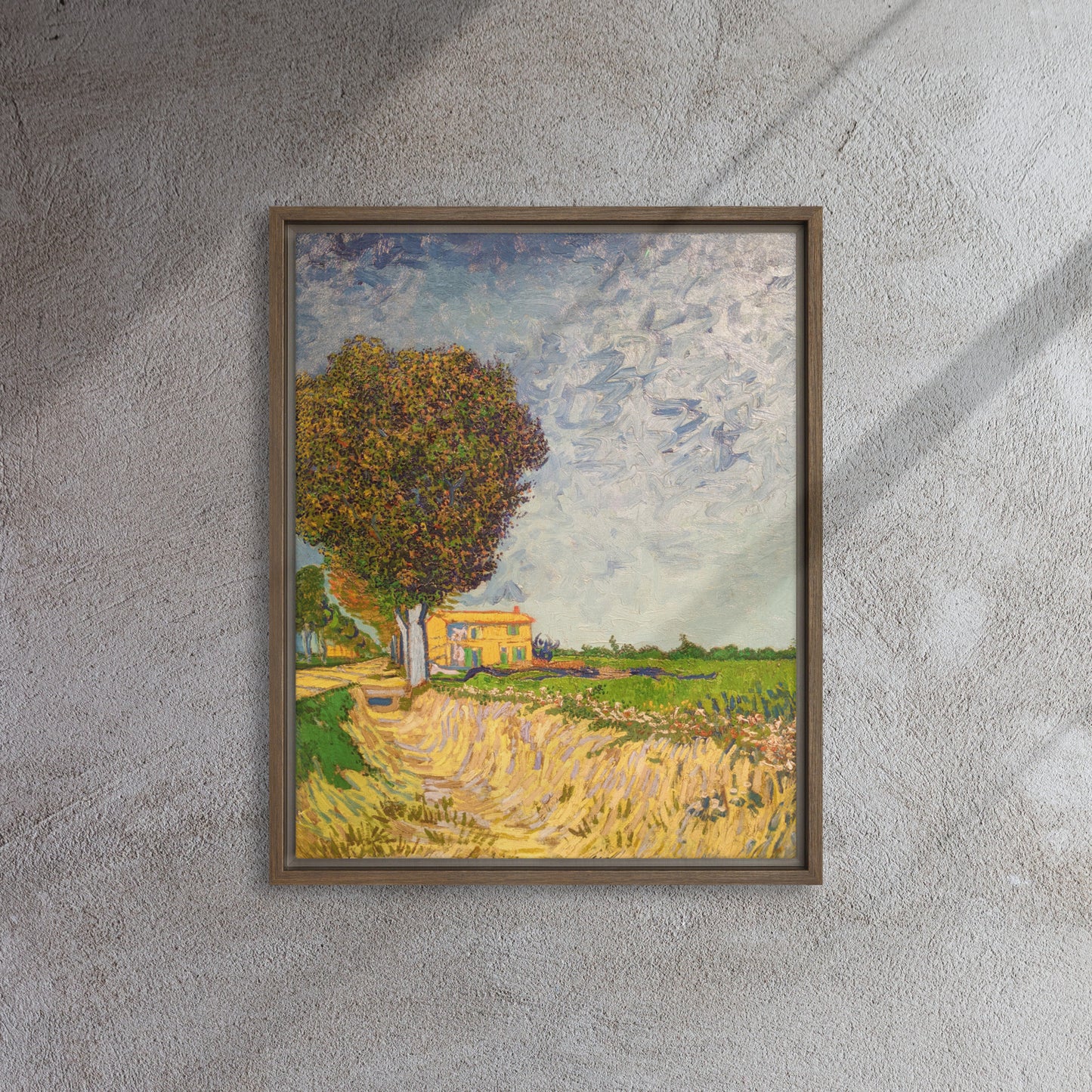 Van Gogh's 'A Lane near Arles' on a 16"x20" brown framed canvas print on a textured gray wall.