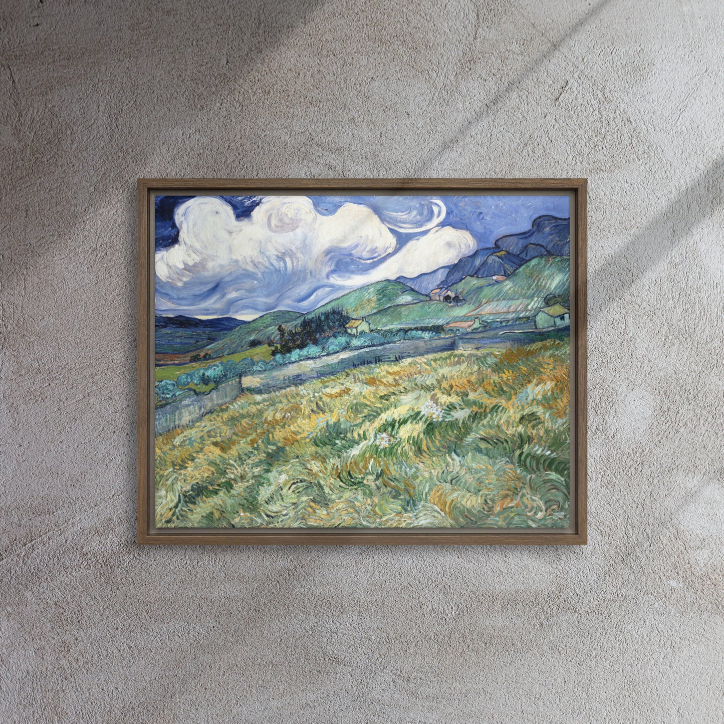 Van Gogh's 'Landscape from Saint-Rémy' on a 16"x20" brown framed canvas print on a textured gray wall.