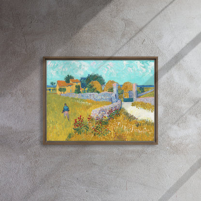 Van Gogh's 'Farmhouse in Provence' on a 18"x24" brown framed canvas print on a textured gray wall.
