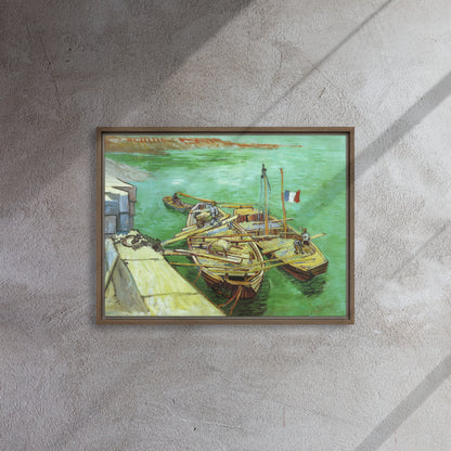 Van Gogh's 'Quay with Men Unloading Sand Barges' on a 18"x24" brown framed canvas print on a textured gray wall.