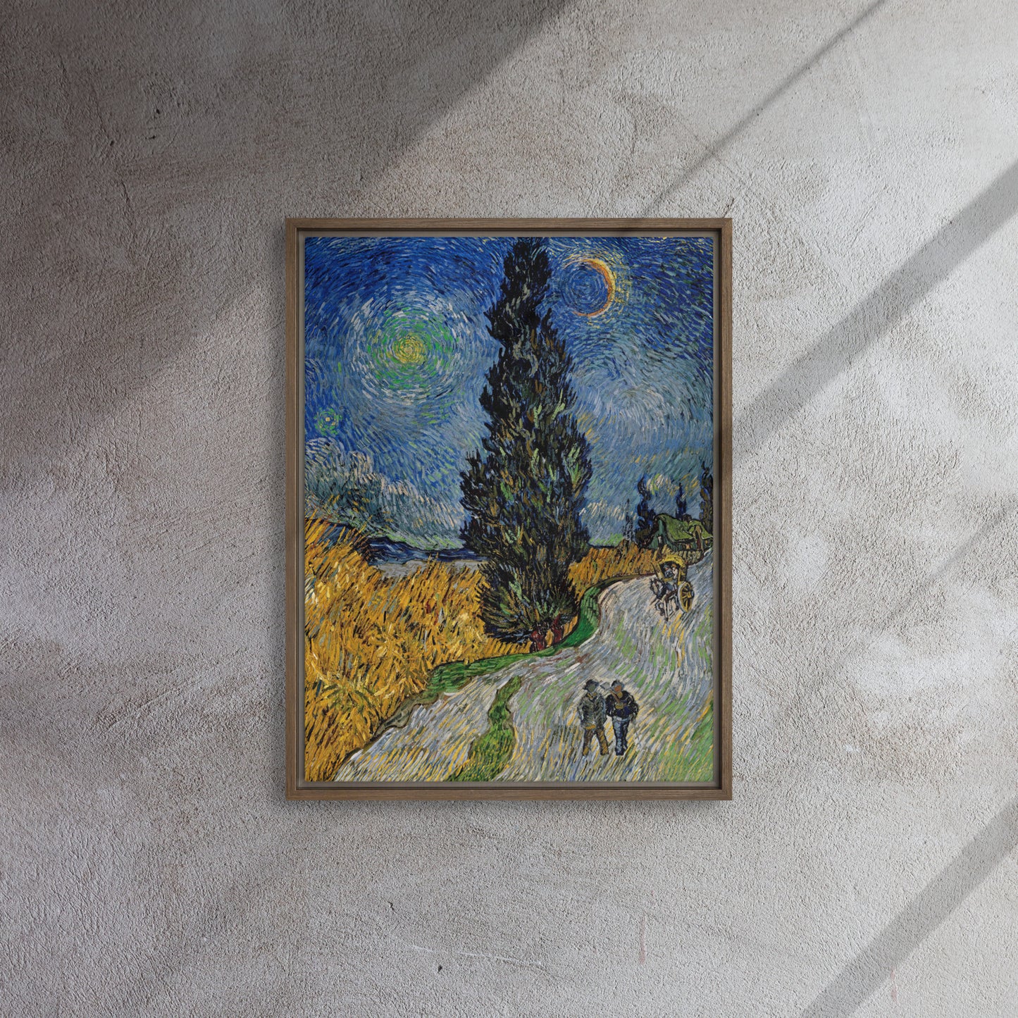 Van Gogh's 'Road with Cypress and Star' on a 18"x24" brown framed canvas print on a textured gray wall.