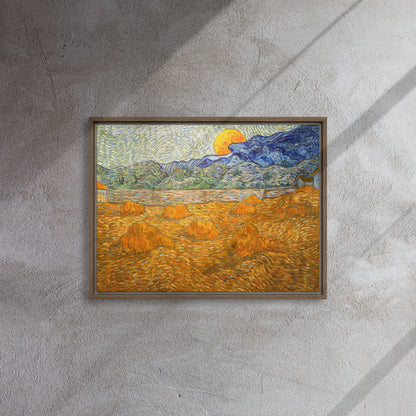 Van Gogh's 'Landscape with Wheat Sheaves and Rising Moon' on a 18"x24" brown framed canvas print on a textured gray wall.