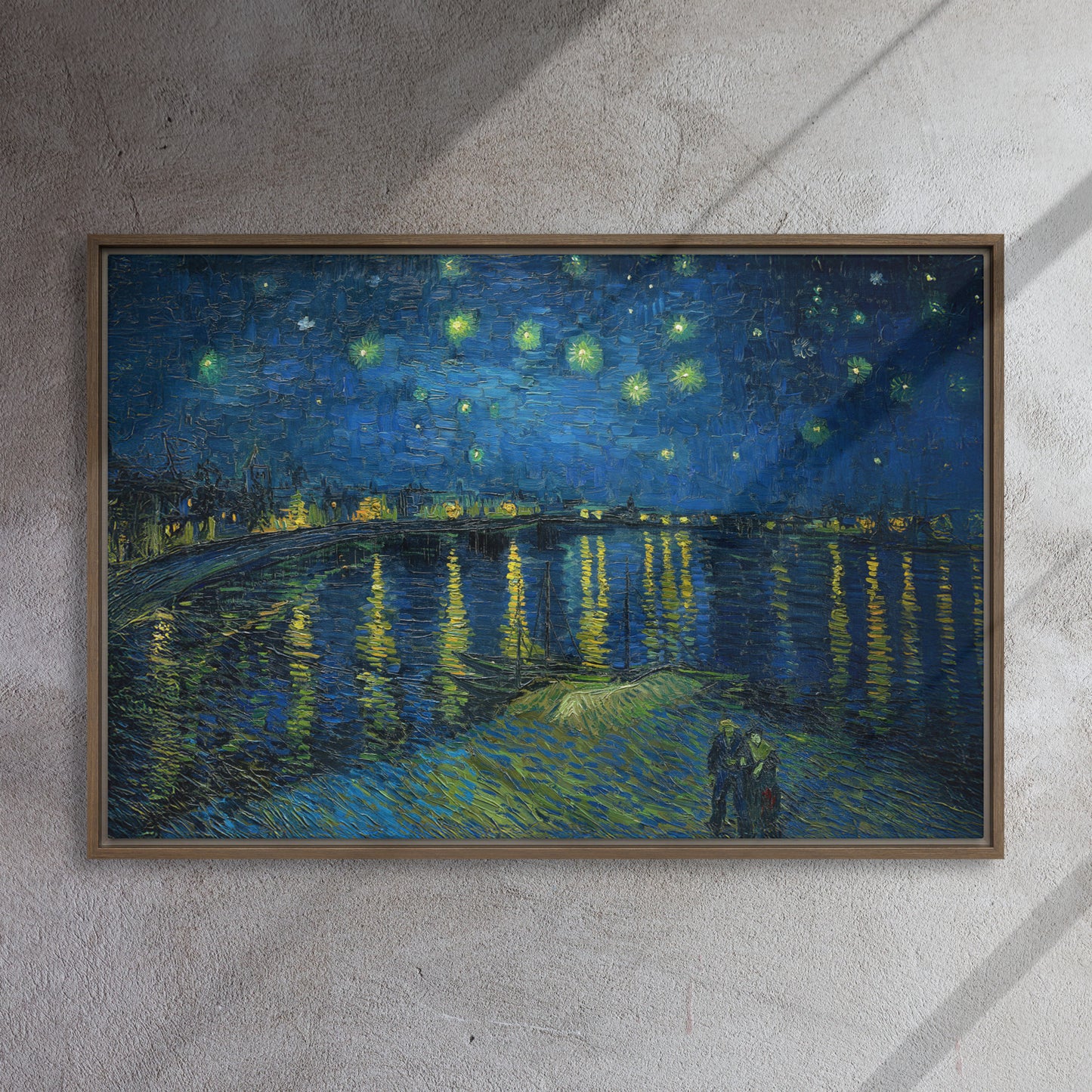 Van Gogh's 'Starry Night Over the Rhone' on a 24"x36" brown framed canvas print on a textured gray wall.