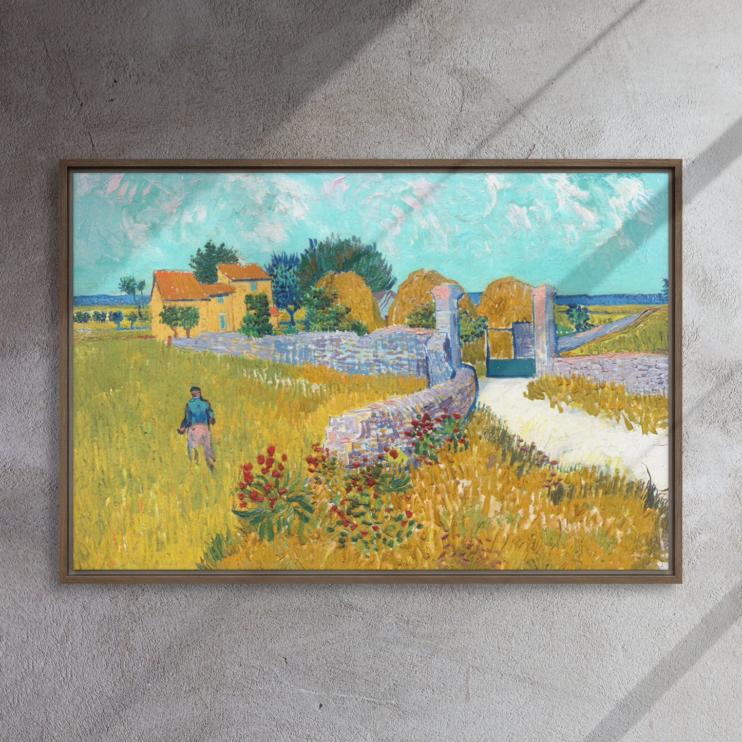 Van Gogh's 'Farmhouse in Provence' on a 24"x36" brown framed canvas print on a textured gray wall.