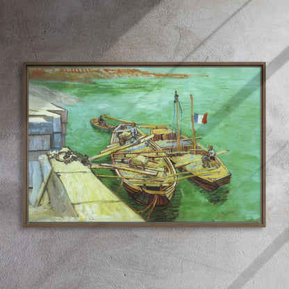 Van Gogh's 'Quay with Men Unloading Sand Barges' on a 24"x36" brown framed canvas print on a textured gray wall.