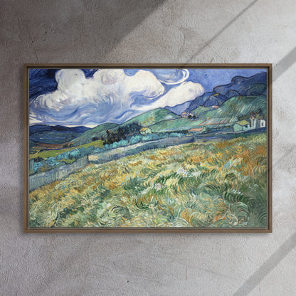 Van Gogh's 'Landscape from Saint-Rémy' on a 24"x36" brown framed canvas print on a textured gray wall.