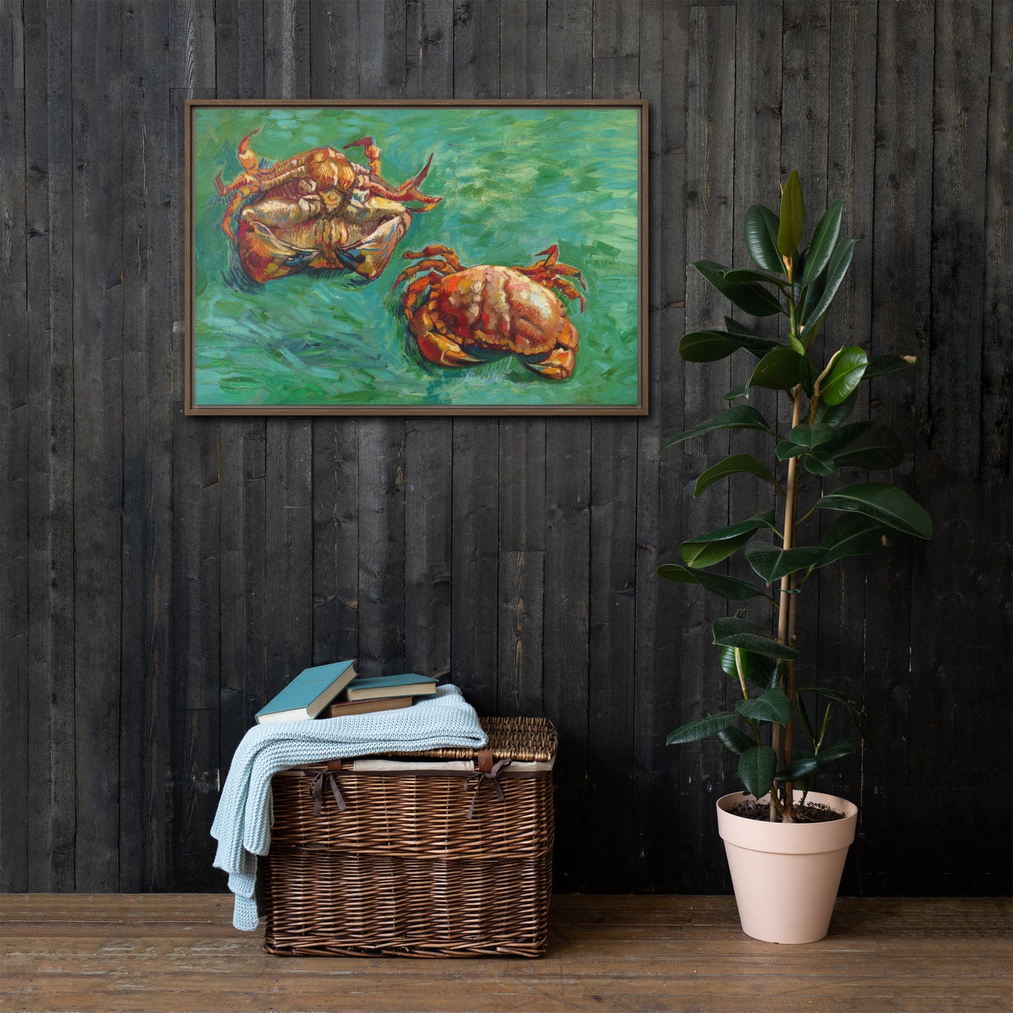 Van Gogh's 'Two Crabs' on a 24"x36" brown framed canvas print on a dark wooden wall with a wicker bin and plant below.