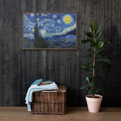 Van Gogh's 'Starry Night' on a 24"x36" brown framed canvas print on a dark wooden wall with a wicker bin and plant below.
