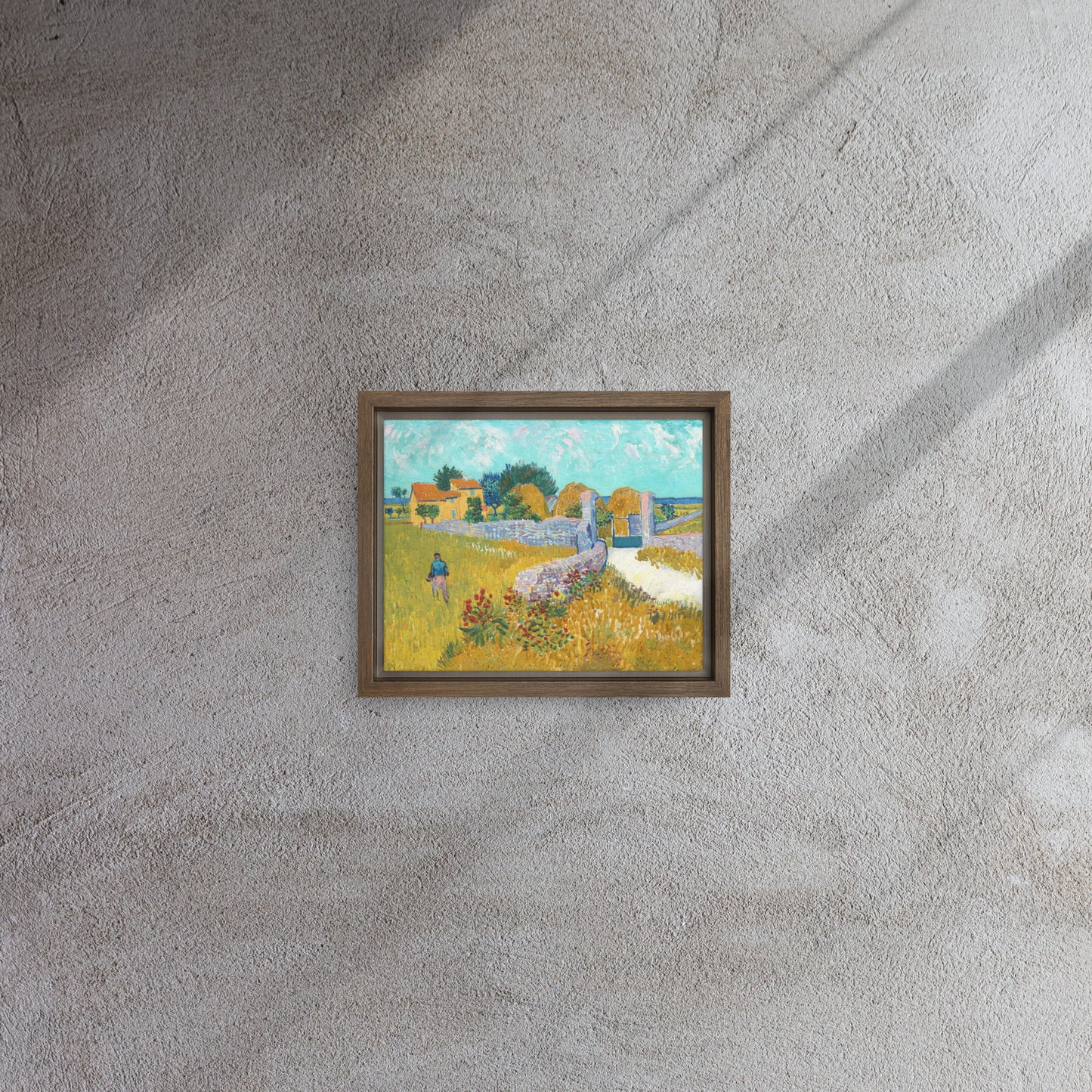 Van Gogh's 'Farmhouse in Provence' on a 8"x10" brown framed canvas print on a textured gray wall.