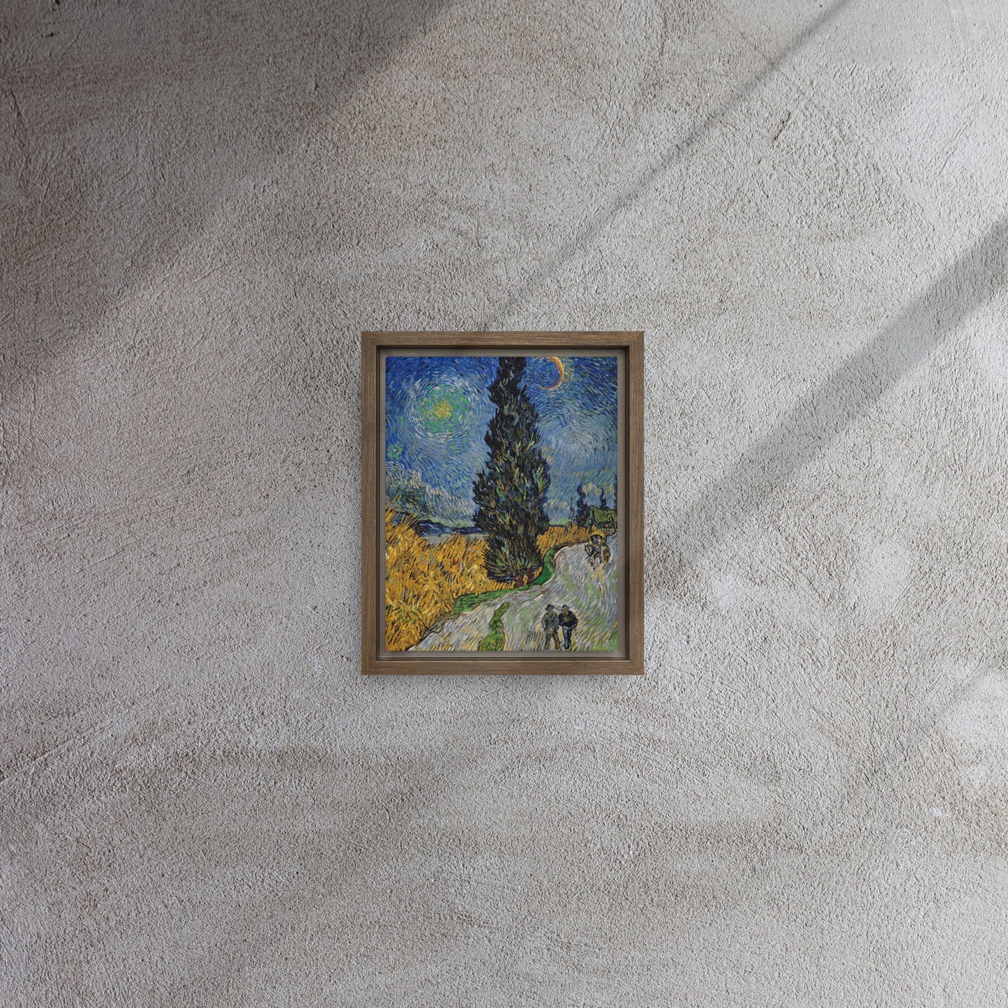 Van Gogh's 'Road with Cypress and Star' on a 8"x10" brown framed canvas print on a textured gray wall.