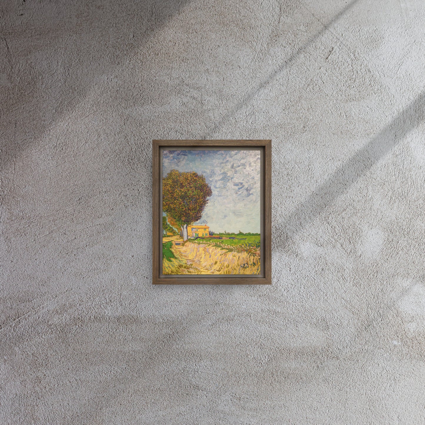 Van Gogh's 'A Lane near Arles' on a 8"x10" brown framed canvas print on a textured gray wall.