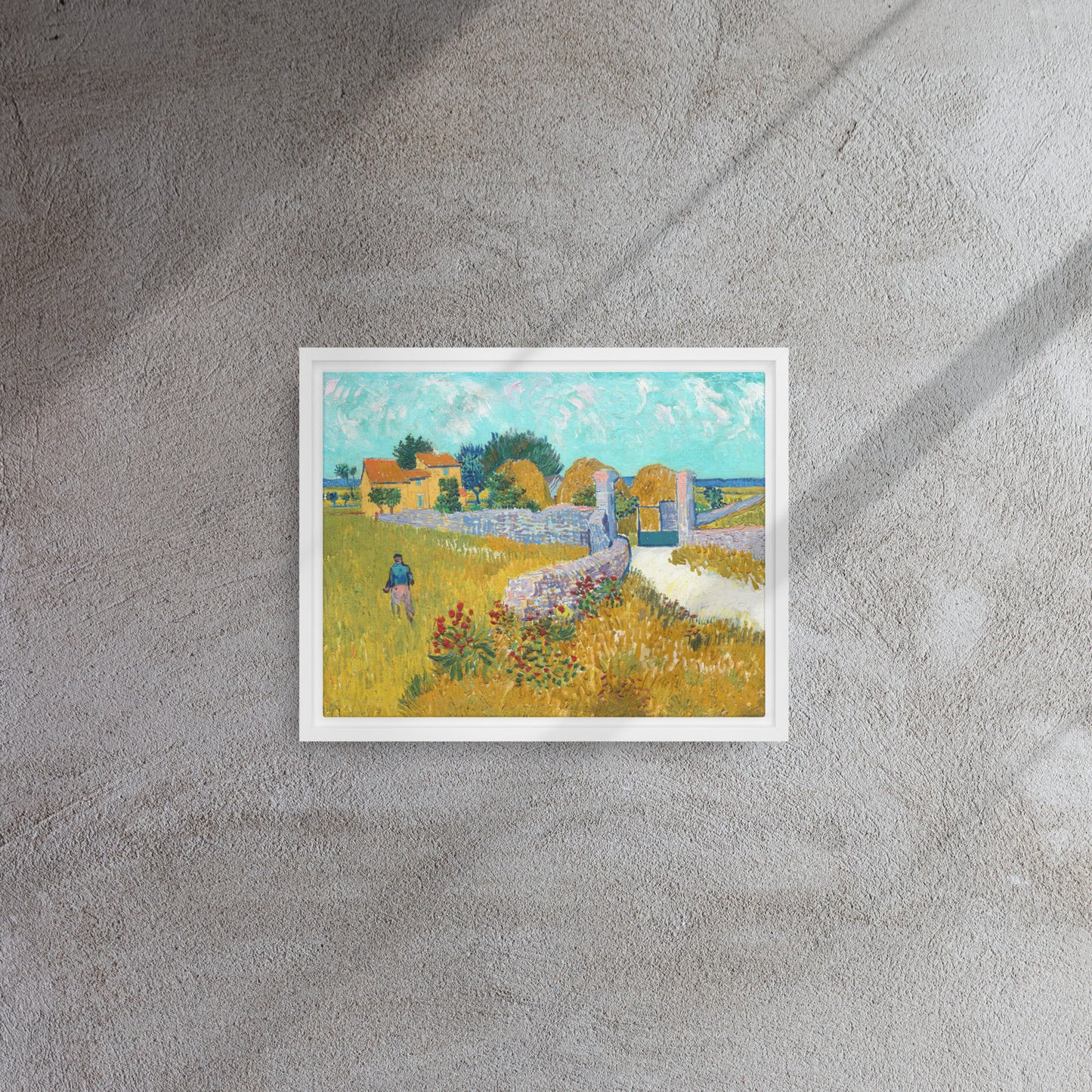 Van Gogh's 'Farmhouse in Provence' on a 11"x14" white framed canvas print on a textured gray wall.
