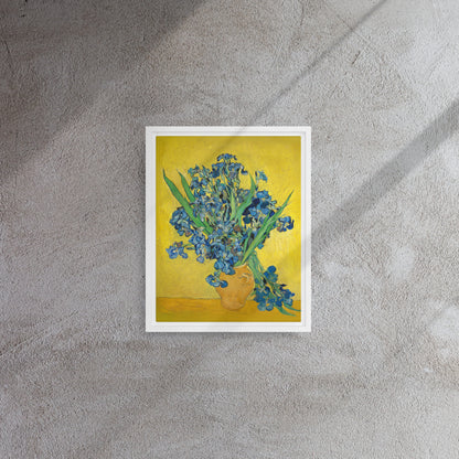 Van Gogh's 'Vase with Irises Against a Yellow Background' on a 11"x14" white framed canvas print on a textured gray wall.