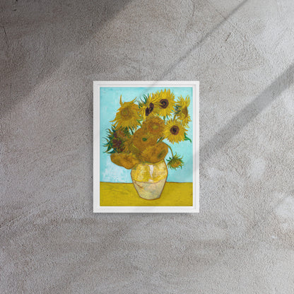 Van Gogh's 'Vase with Twelve Sunflowers' on a 11"x14" white framed canvas print on a textured gray wall.