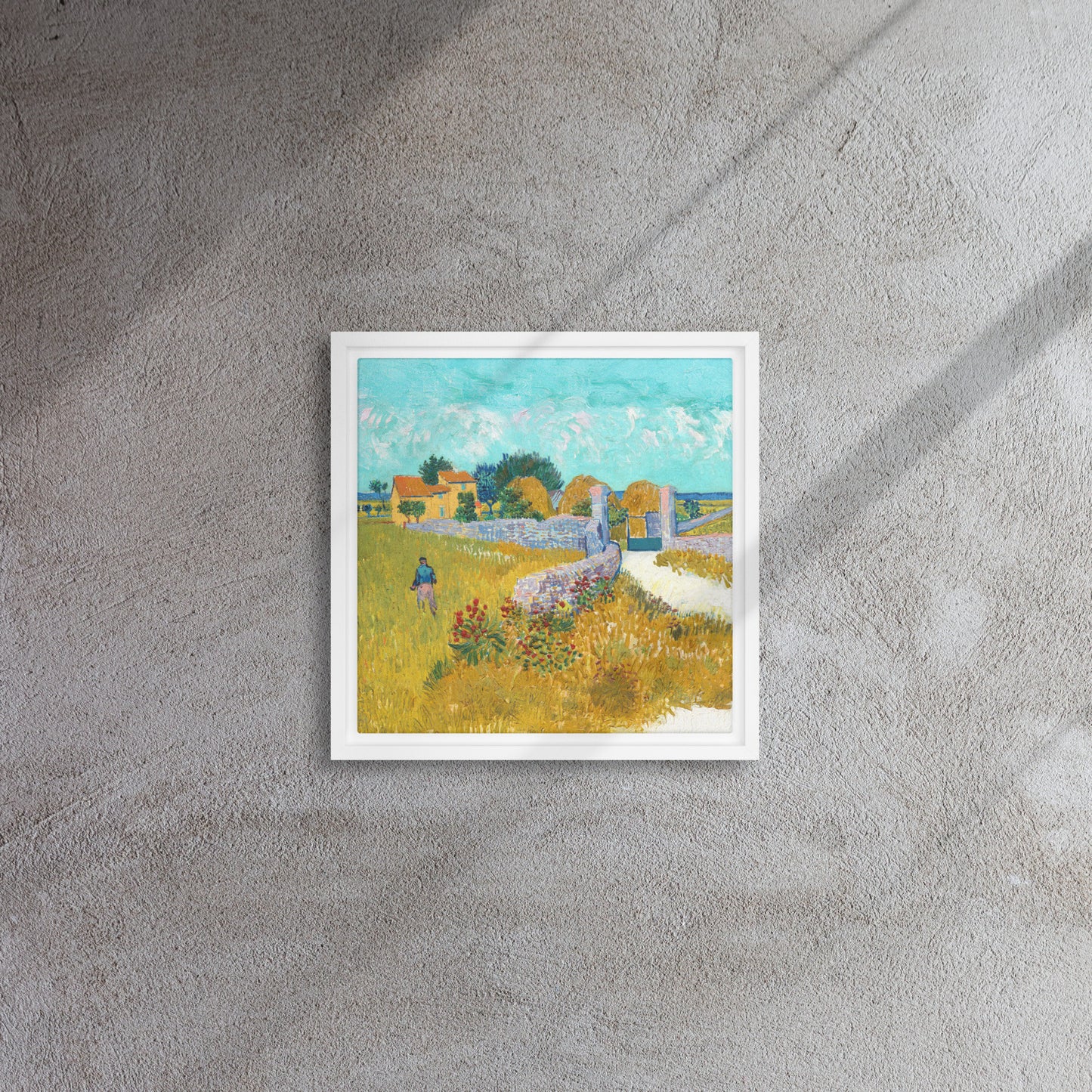 Van Gogh's 'Farmhouse in Provence' on a 12"x12" white framed canvas print on a textured gray wall.
