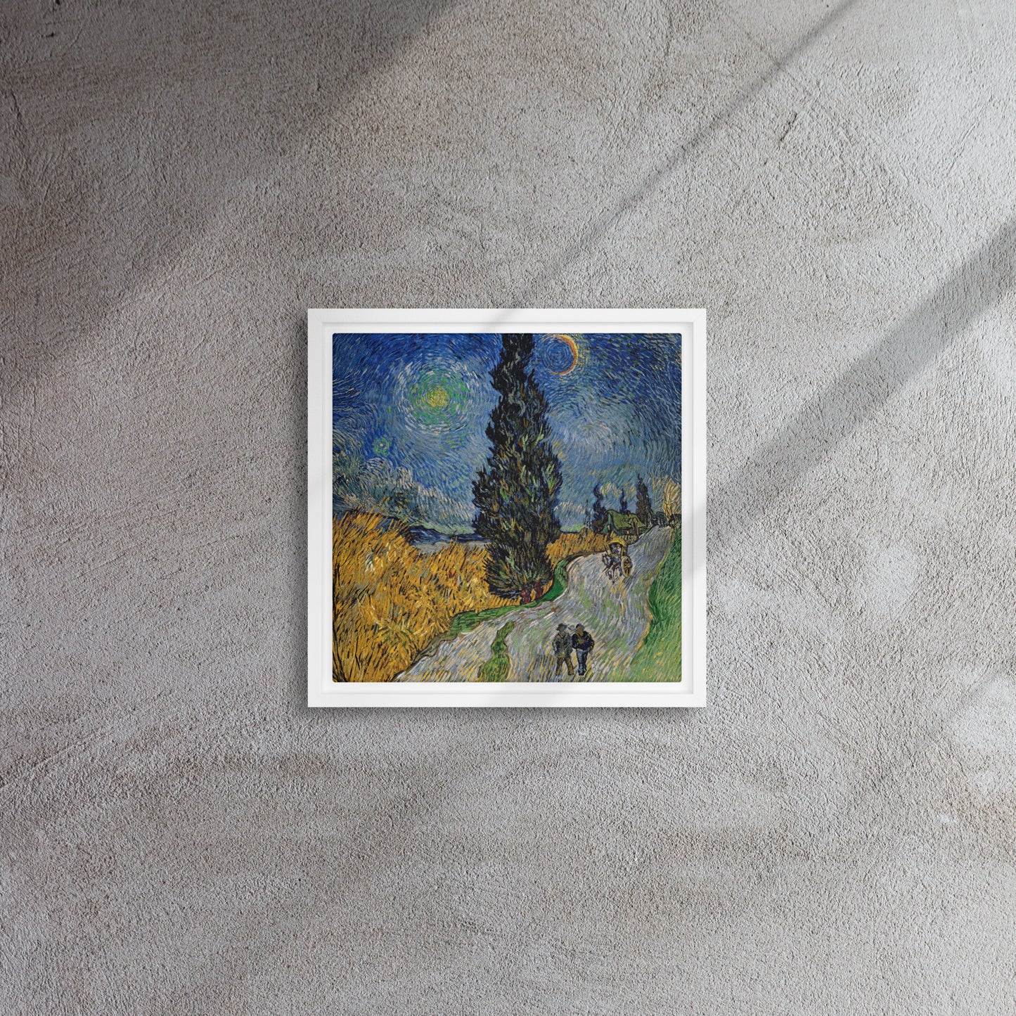 Van Gogh's 'Road with Cypress and Star' on a 12"x12" white framed canvas print on a textured gray wall.