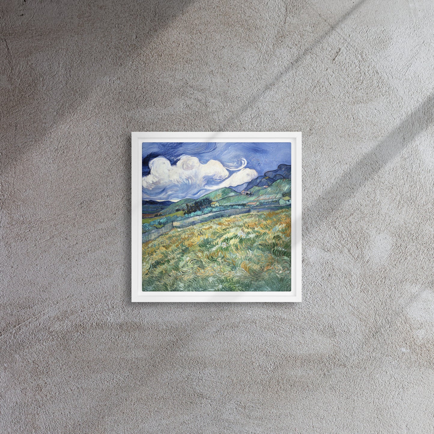 Van Gogh's 'Landscape from Saint-Rémy' on a 12"x12" white framed canvas print on a textured gray wall.