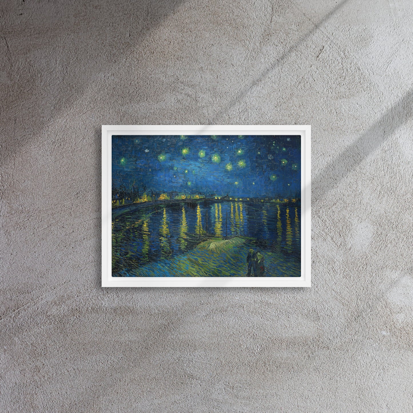 Van Gogh's 'Starry Night Over the Rhone' on a 12"x16" white framed canvas print on a textured gray wall.