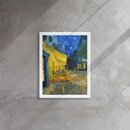 Van Gogh's 'Café Terrace at Night' on a 12"x16" white framed canvas print on a textured gray wall.
