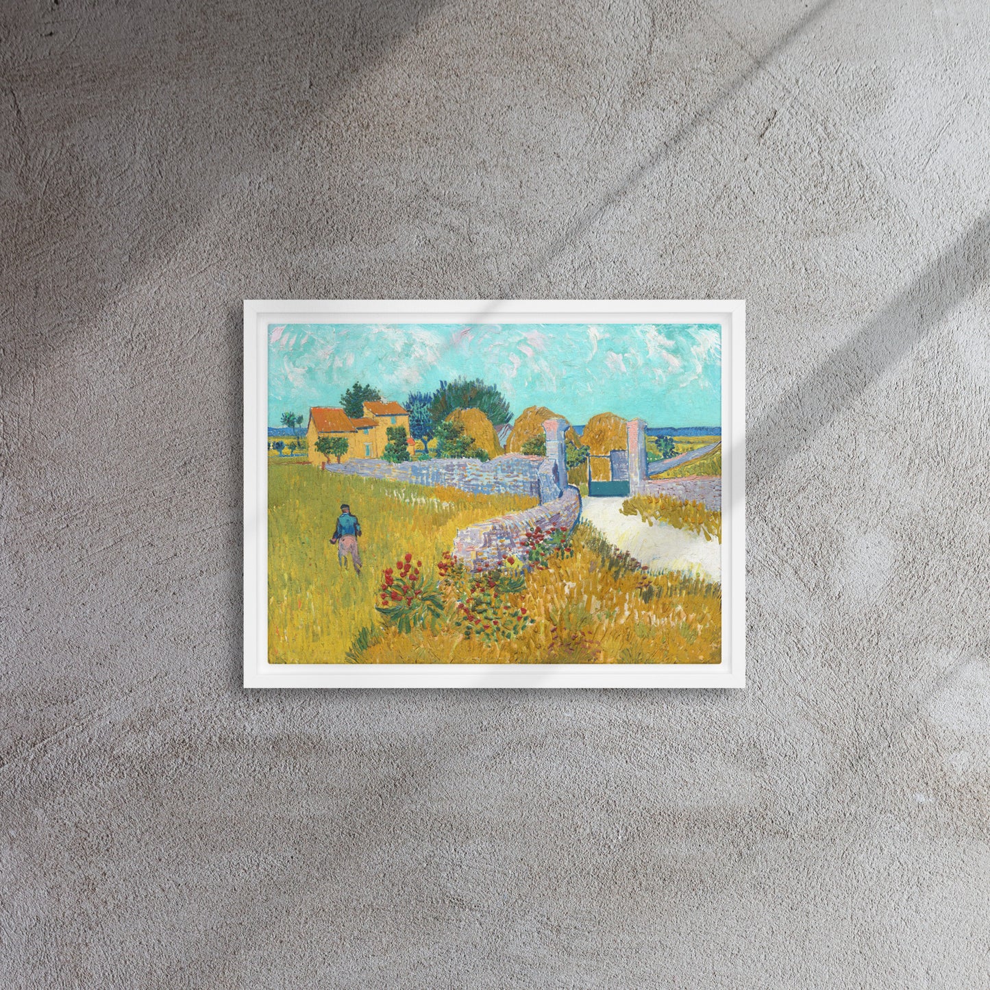 Van Gogh's 'Farmhouse in Provence' on a 12"x16" white framed canvas print on a textured gray wall.