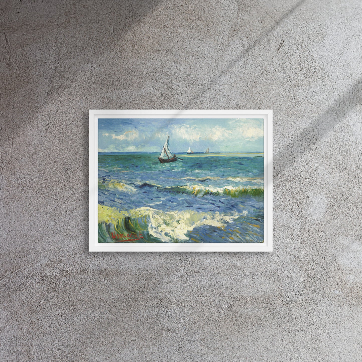 Van Gogh's 'The Sea at Les Saintes-Maries-de-la-Mer' on a 12"x16" white framed canvas print on a textured gray wall.