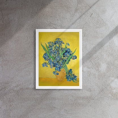 Van Gogh's 'Vase with Irises Against a Yellow Background' on a 12"x16" white framed canvas print on a textured gray wall.