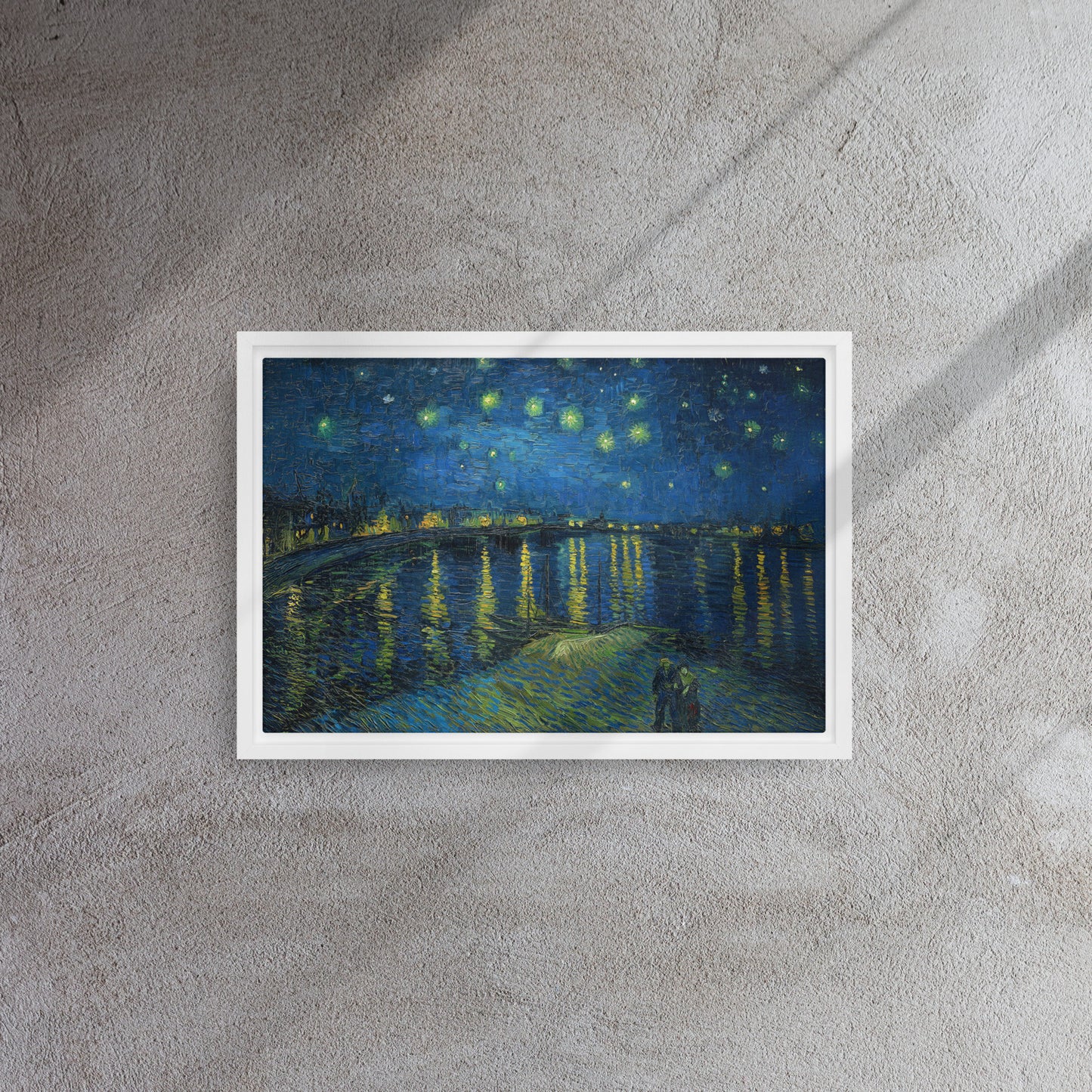 Van Gogh's 'Starry Night Over the Rhone' on a 12"x18" white framed canvas print on a textured gray wall.