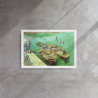 Van Gogh's 'Quay with Men Unloading Sand Barges' on a 12"x18" white framed canvas print on a textured gray wall.
