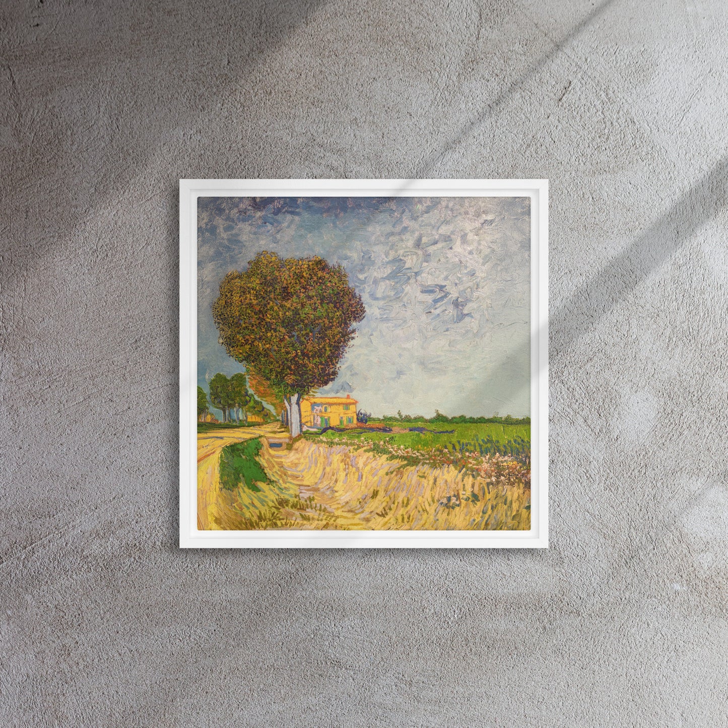 Van Gogh's 'A Lane near Arles' on a 16"x16" white framed canvas print on a textured gray wall.