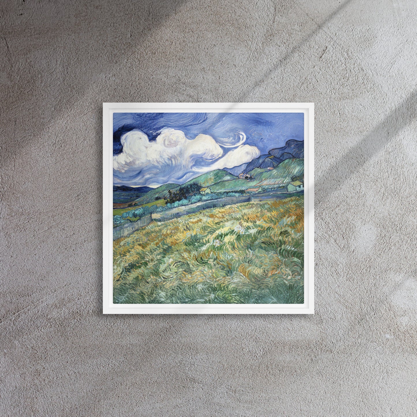 Van Gogh's 'Landscape from Saint-Rémy' on a 16"x16" white framed canvas print on a textured gray wall.