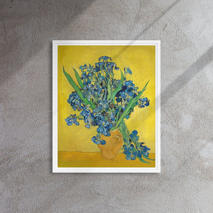 Van Gogh's 'Vase with Irises Against a Yellow Background' on a 16"x20" white framed canvas print on a textured gray wall.