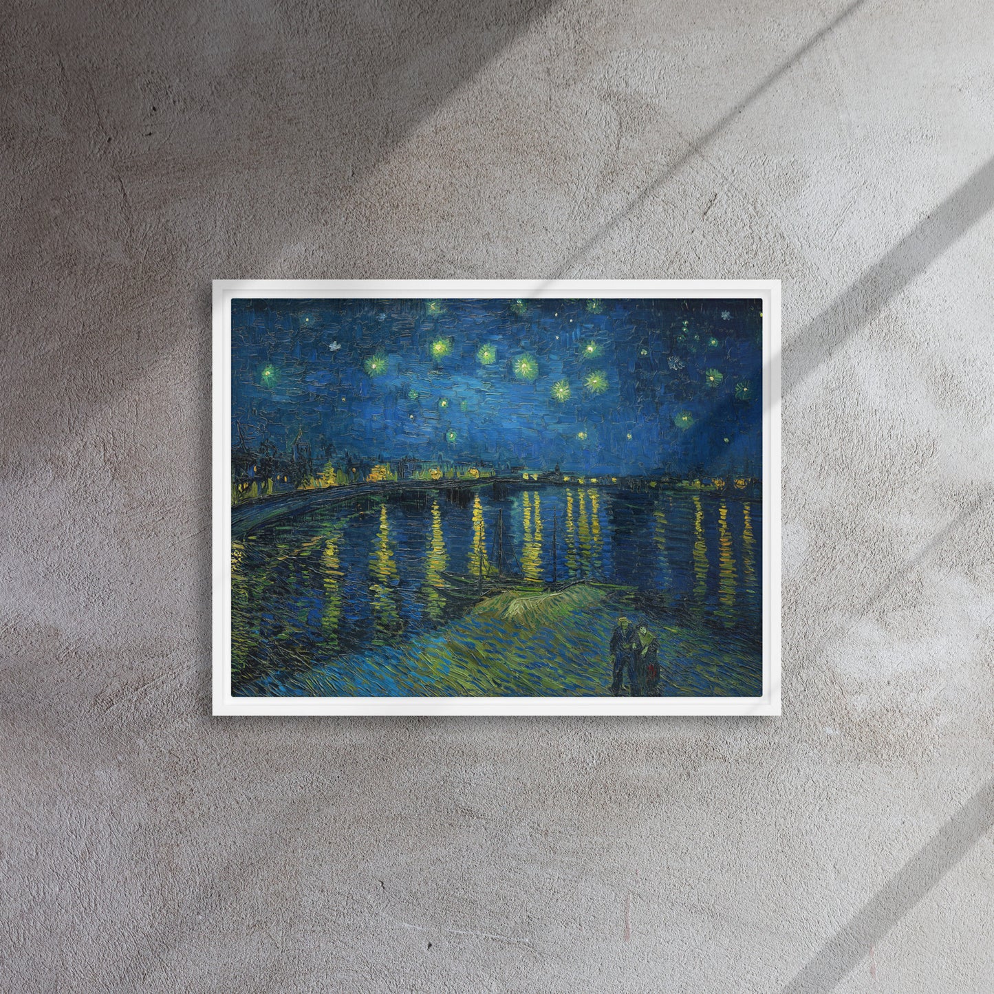 Van Gogh's 'Starry Night Over the Rhone' on a 18"x24" white framed canvas print on a textured gray wall.